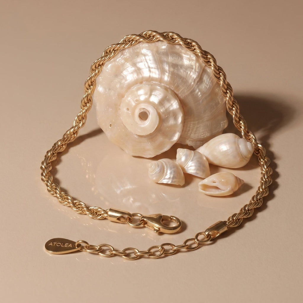 Calvi 14k Gold Rope Chain Bracelet Flat Lay With Shell Background, Twisted Waterproof Jewelry