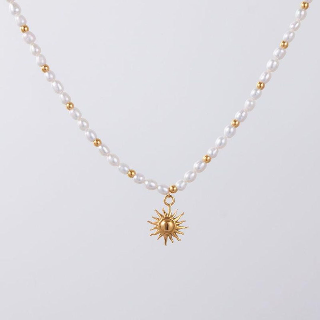 sun-pendant-gold-necklace-white-background
