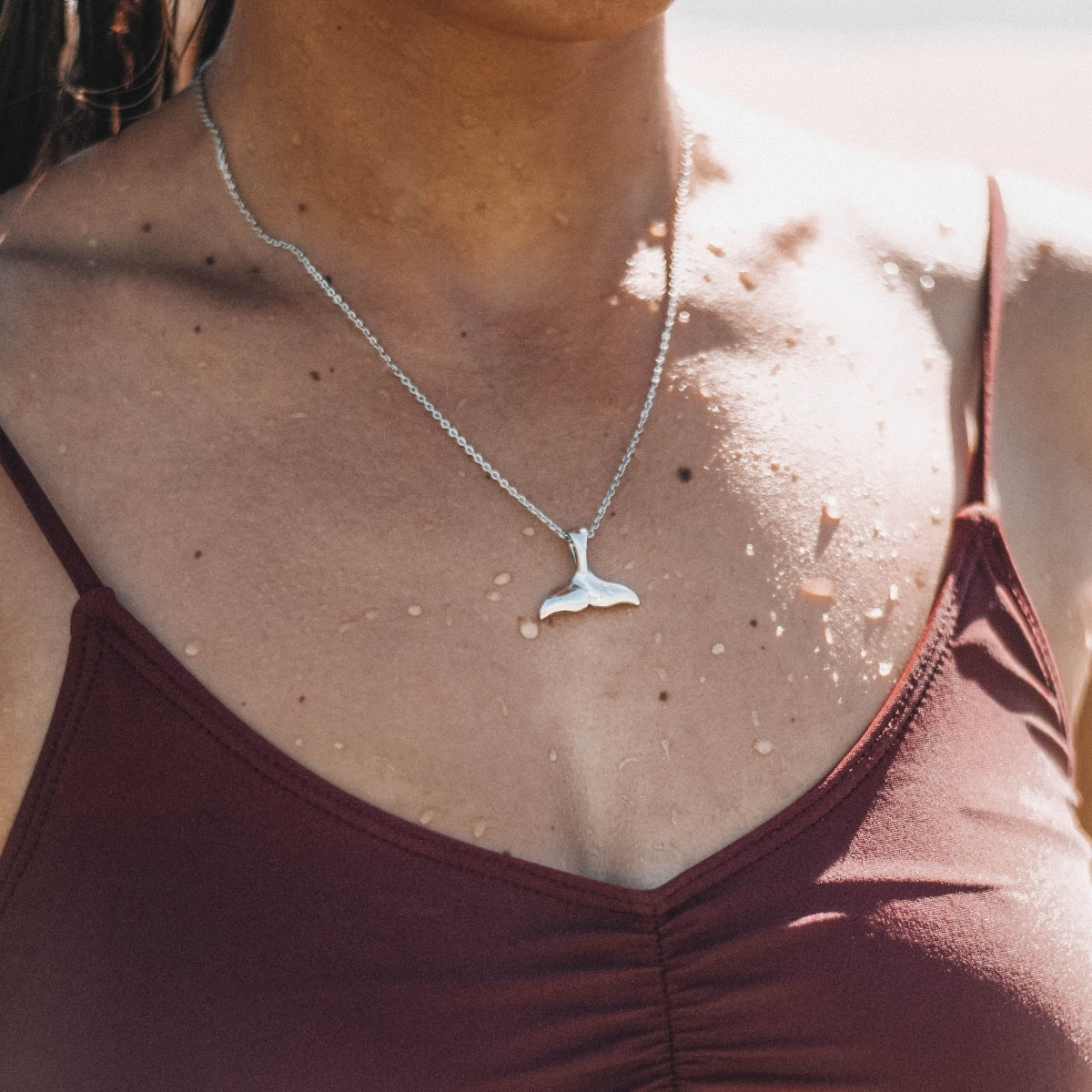 whale-tail-necklace-silver-on-model